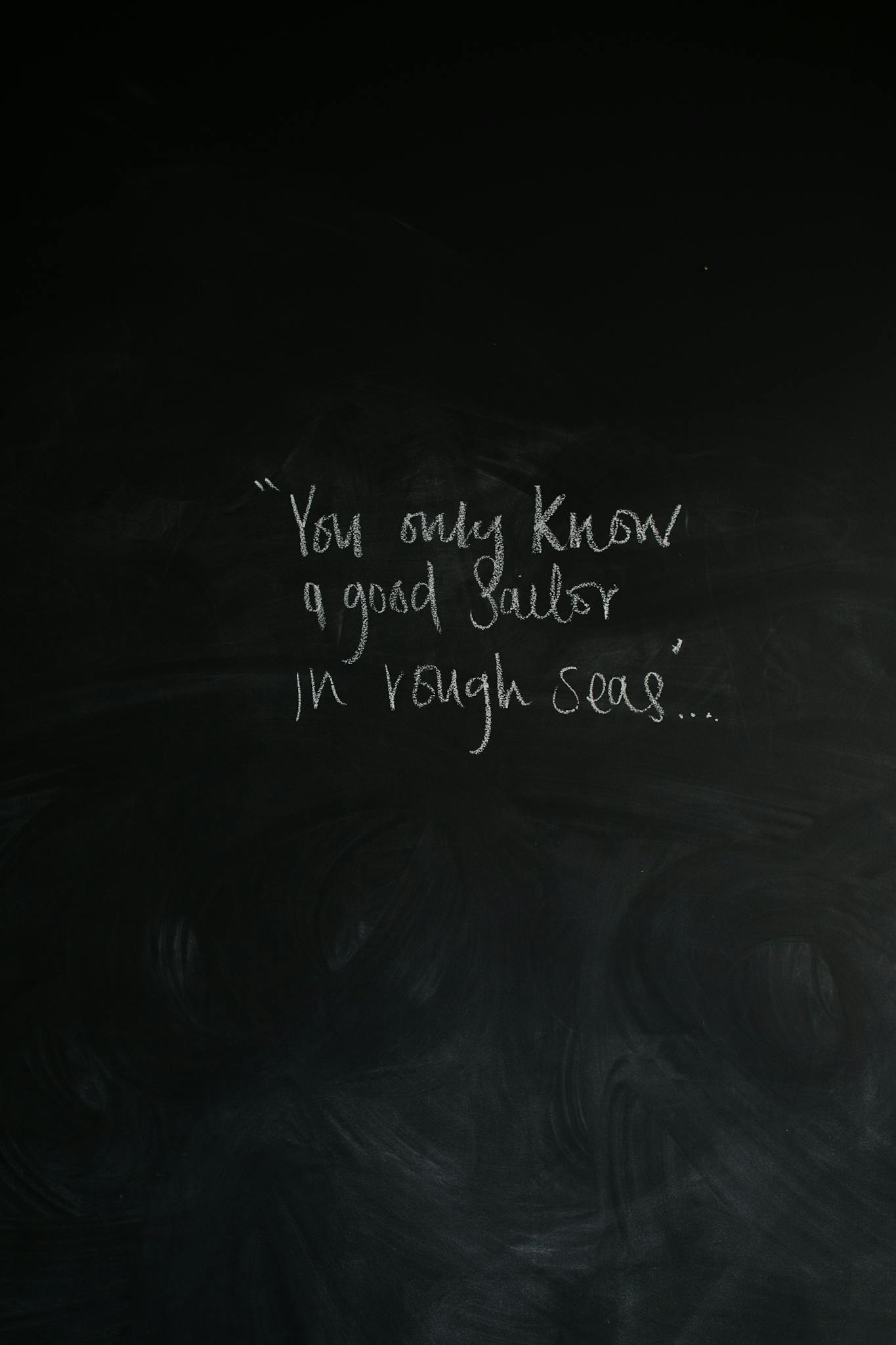 Inspirational message about sailors on a chalkboard background, perfect for motivational themes.